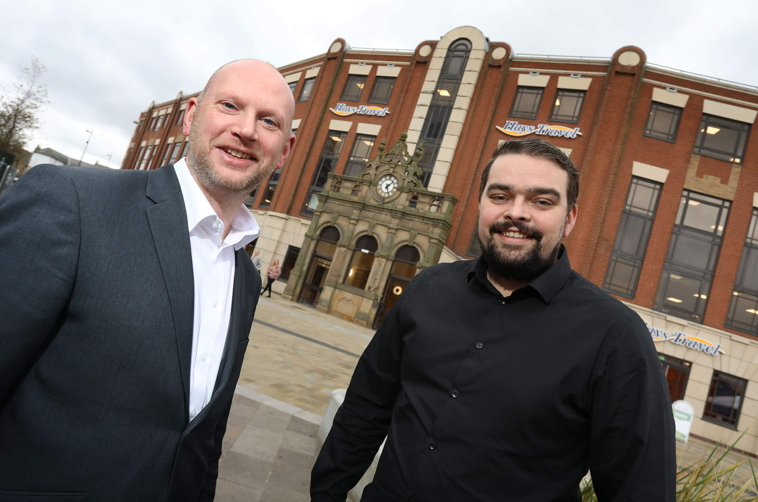 John Milburn, Head of Marketing, Digital and Telesales at Hays Travel alongside Scott Duncan, Business Development Manager at Advantex outside Gilbridge House in Sunderland